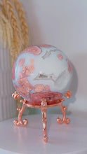 Load and play video in Gallery viewer, Pink Agate Druzy Sphere with Rose Stand
